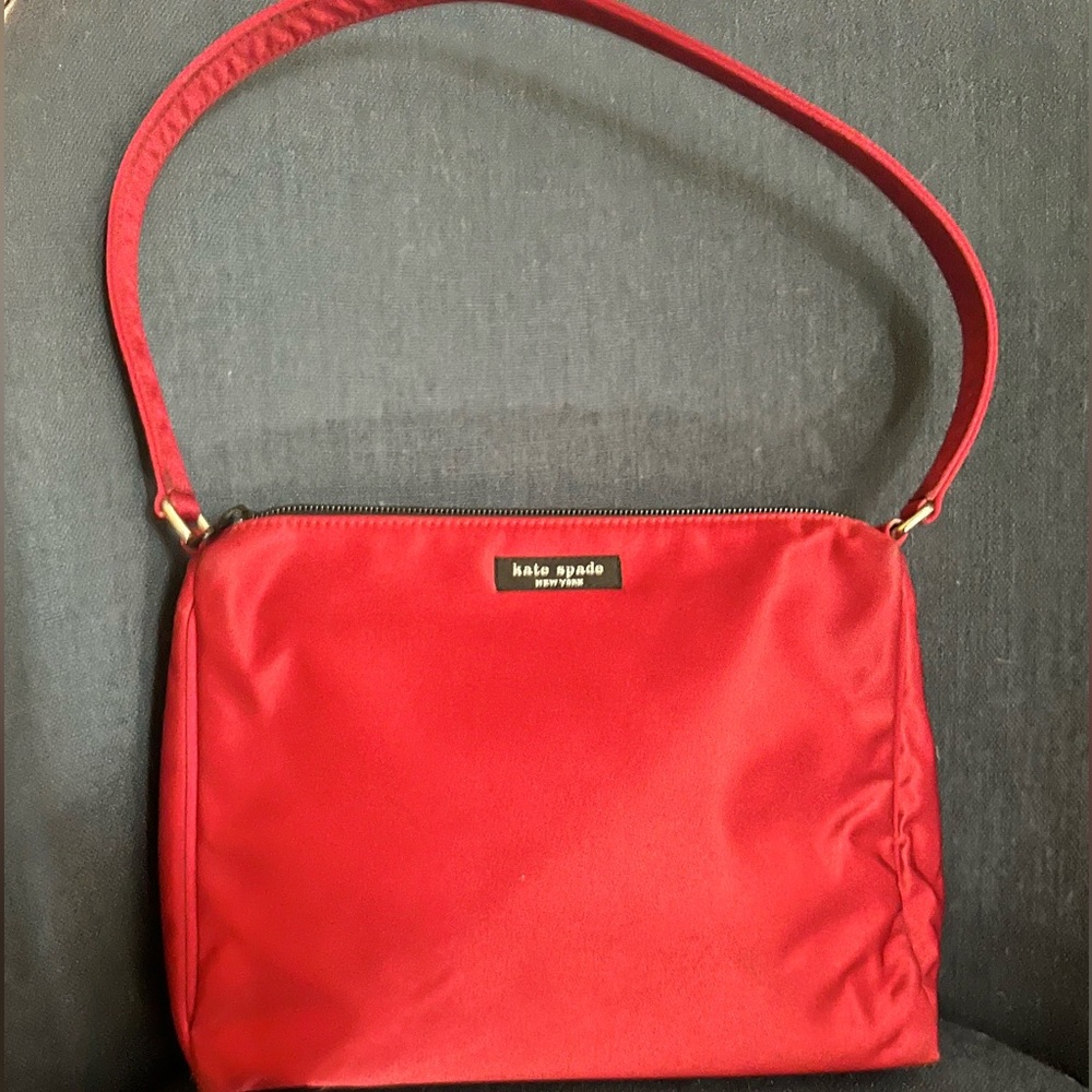 Vintage Kate Spade purse. Red Satin shoulder bag. Small pen mark on back.